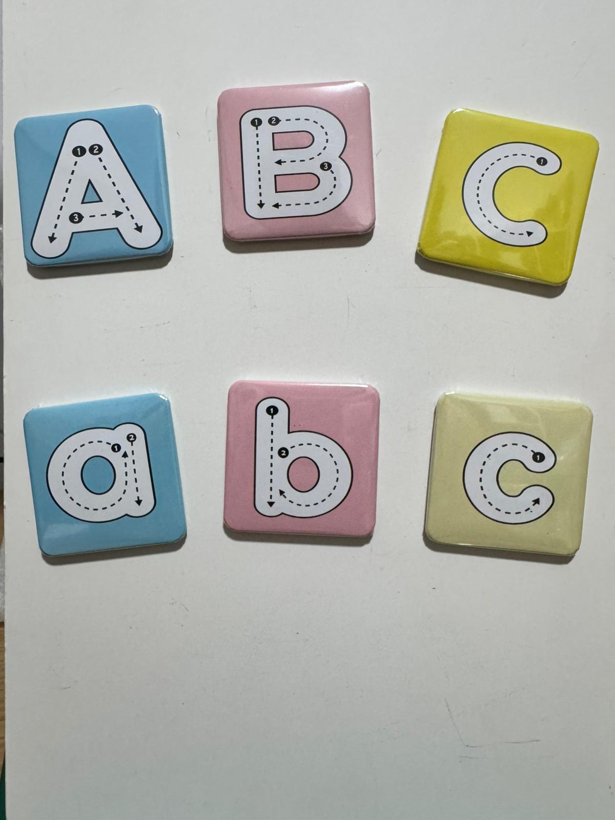 Set of colorful letter tiles with uppercase A, B, C and lowercase a, b, c on a white background